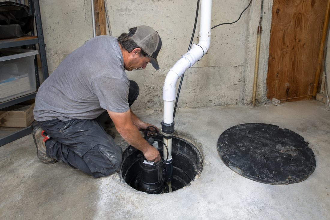 A sump pump replacement in a basement pit at a hillside 1970s ranch home in Vista, inland San Diego County in Vista, CA